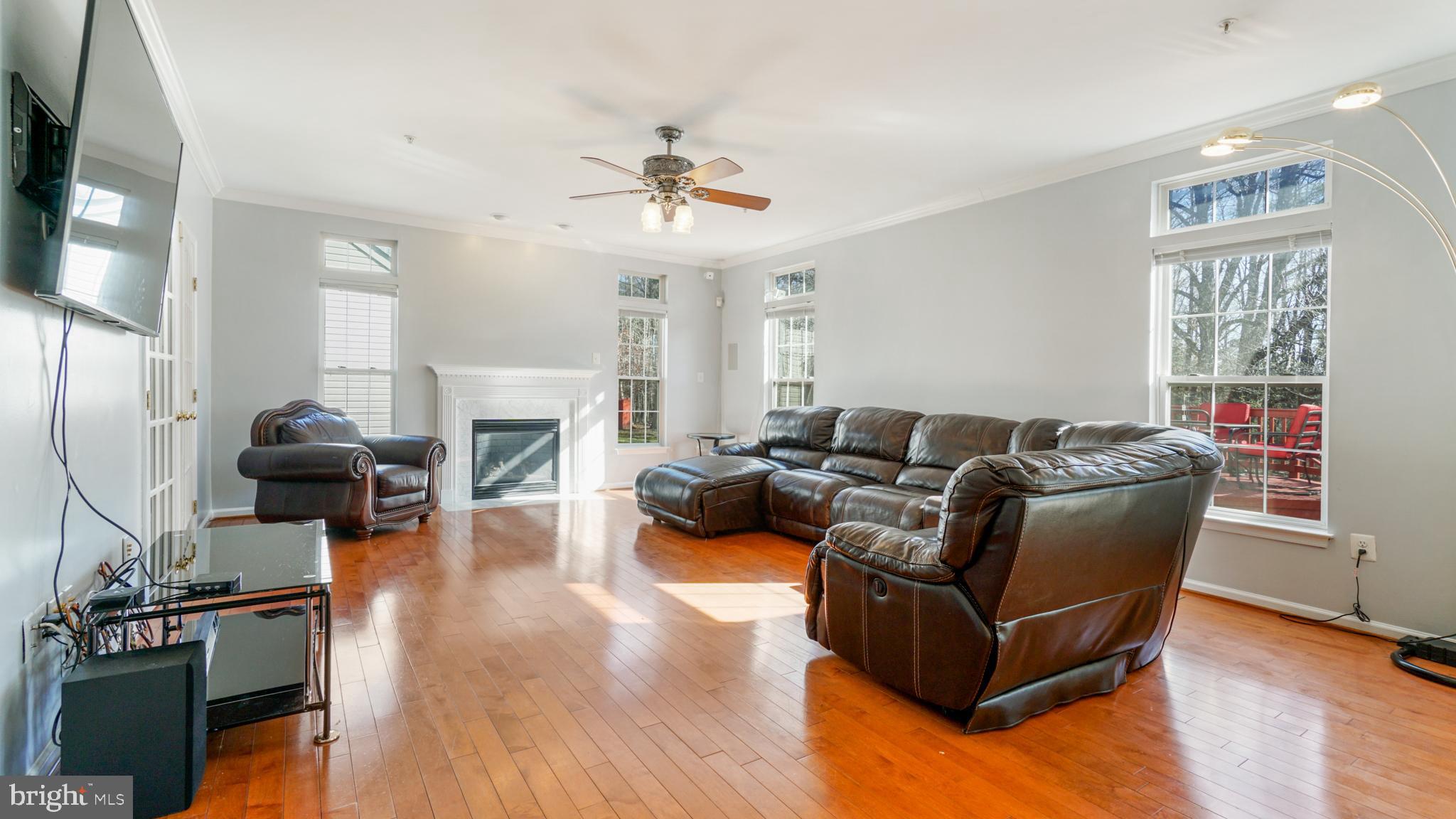 9626 Stuart Lane Clinton, MD 20735 - Photo 11 of 29 family room with fire place ,hardwood floor
