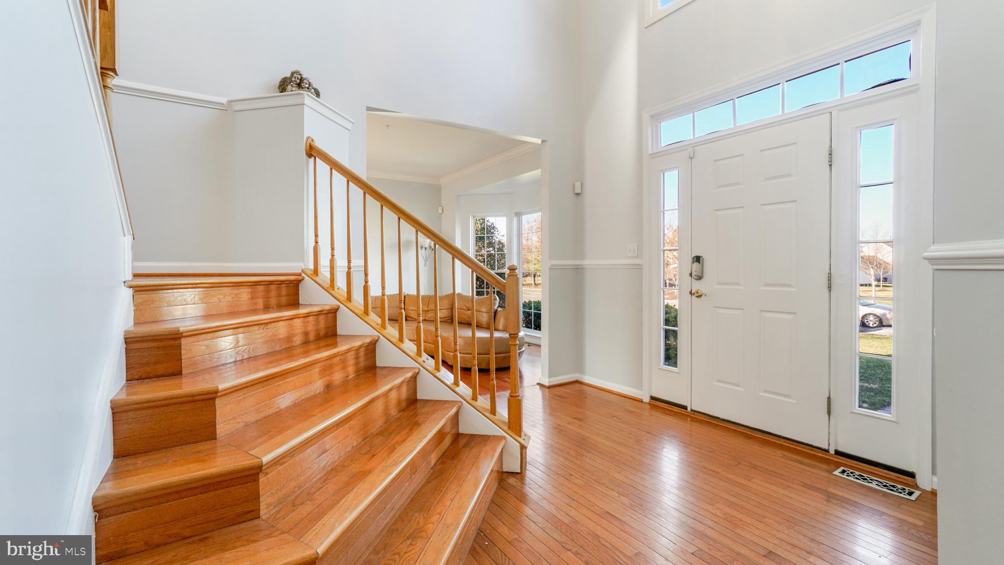 9626 Stuart Lane Clinton, MD 20735 - Photo 4 of 29 main foyer with waterfall stairs