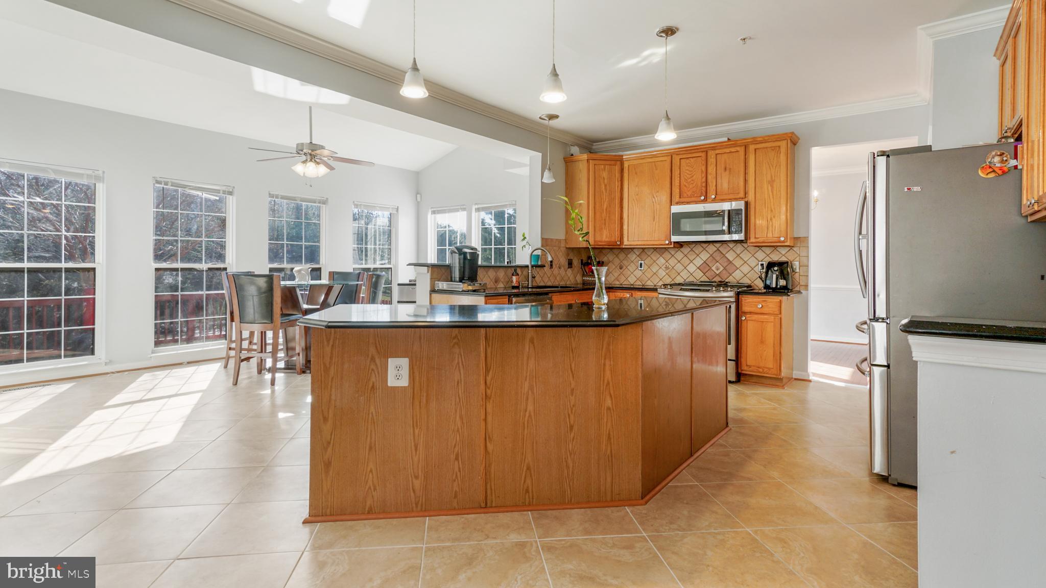 9626 Stuart Lane Clinton, MD 20735 - Photo 8 of 29 kitchen/sunroom plenty windows new ceramic floors