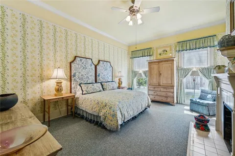 a bedroom with a bed a couch and dresser