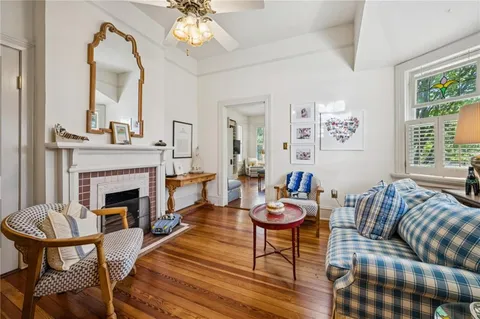 a living room with furniture and a fireplace