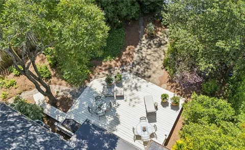 a view of balcony with yard and outdoor seating