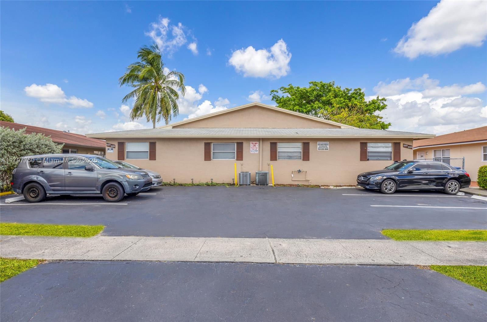 5321 Northwest 22nd Street Lauderhill, FL 33313 - Photo 1 of 10 a front view of a house with cars parked