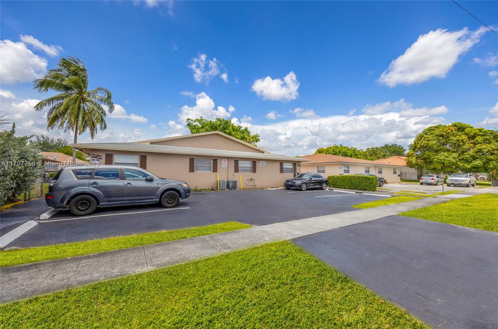 5321 Northwest 22nd Street Lauderhill, FL 33313 - Photo 2 of 10 a front view of a house with swimming pool yard and outdoor seating