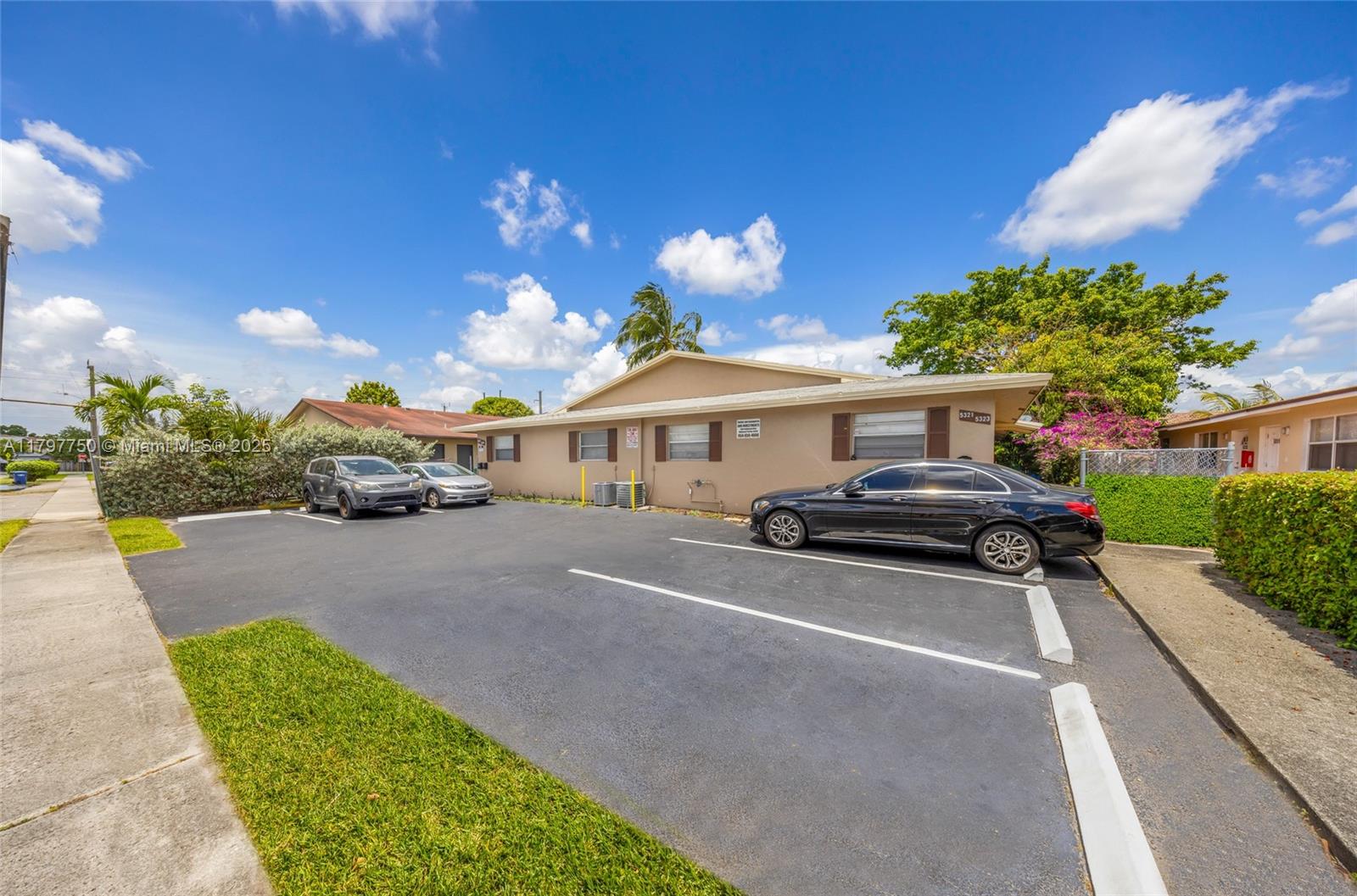 5321 Northwest 22nd Street Lauderhill, FL 33313 - Photo 3 of 10 a car parked in front of a house