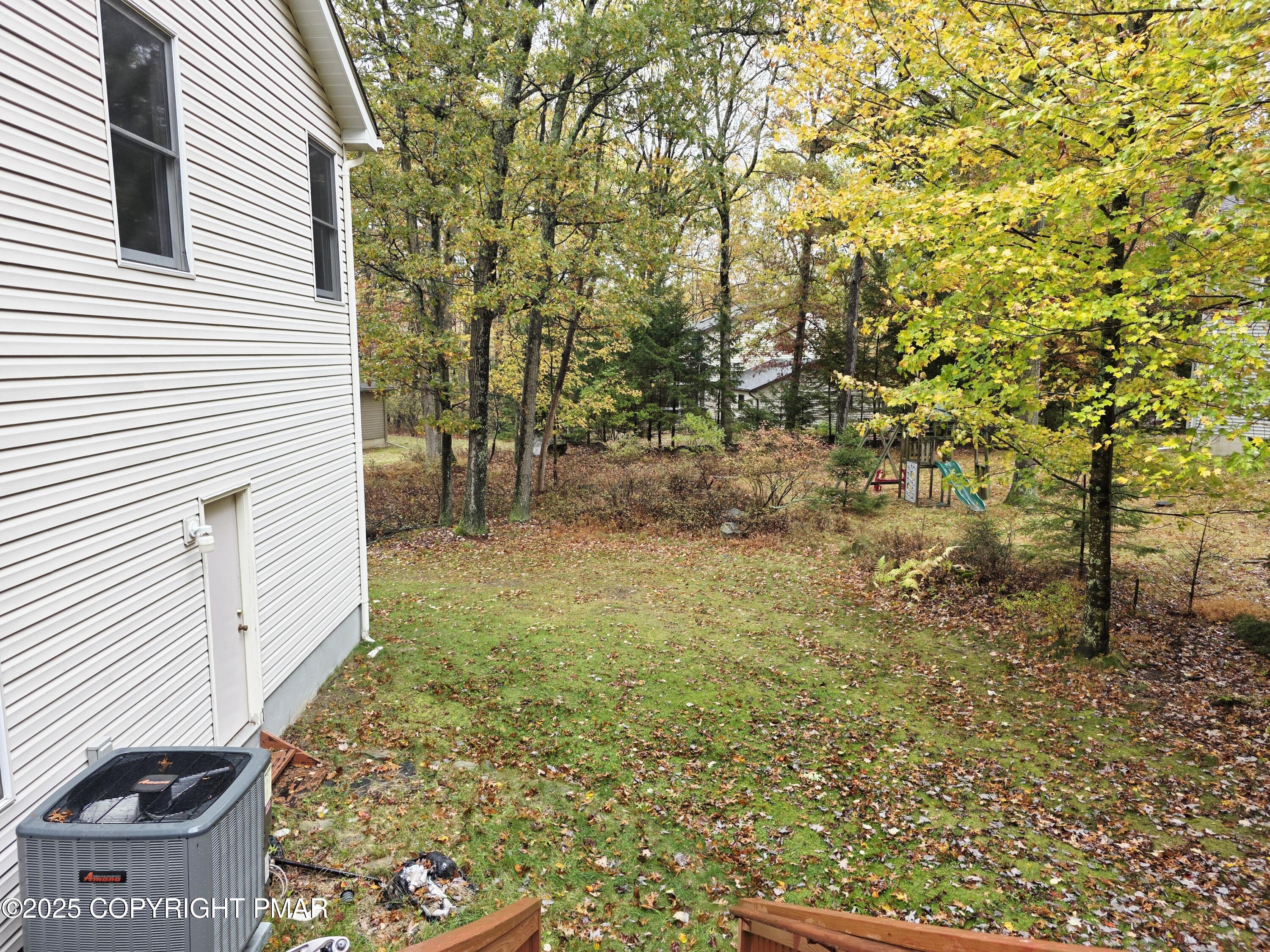 1001 Long Lake Road Tamiment, PA 18371 - Photo 30 of 38 a view of a yard with plants and trees