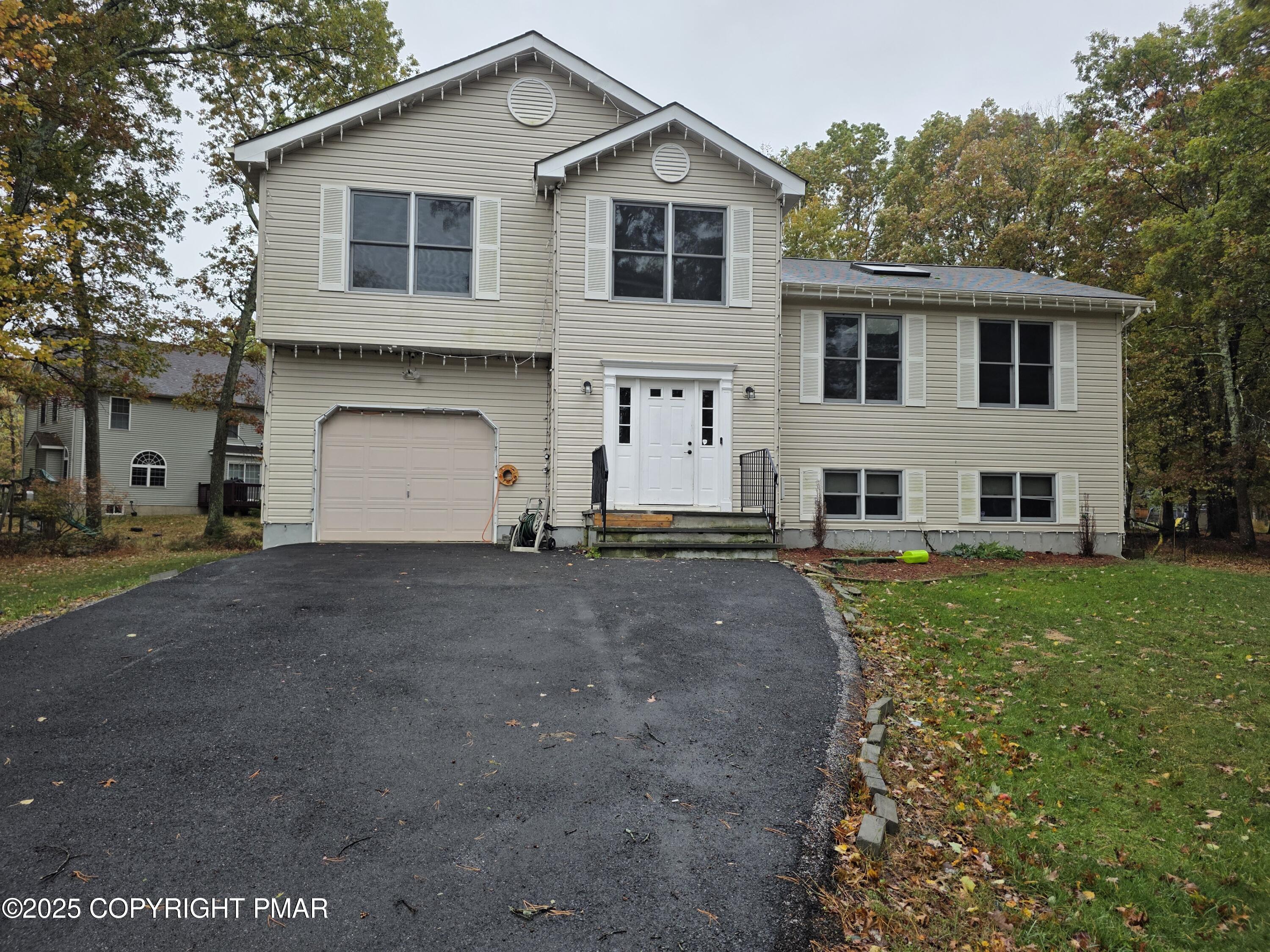 1001 Long Lake Road Tamiment, PA 18371 - Photo 36 of 38 a view of a white house with a yard