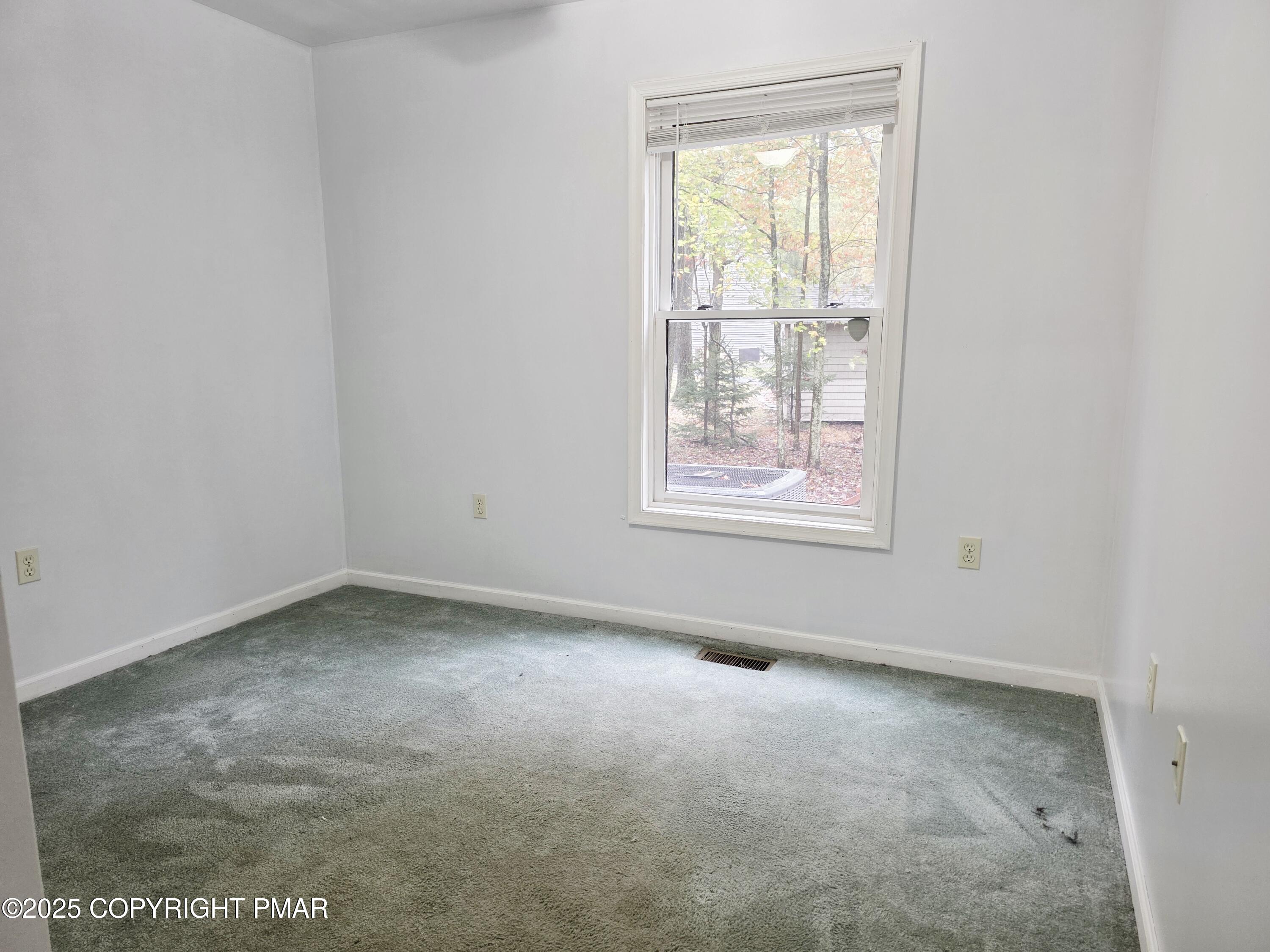 1001 Long Lake Road Tamiment, PA 18371 - Photo 5 of 38 an empty room with a window