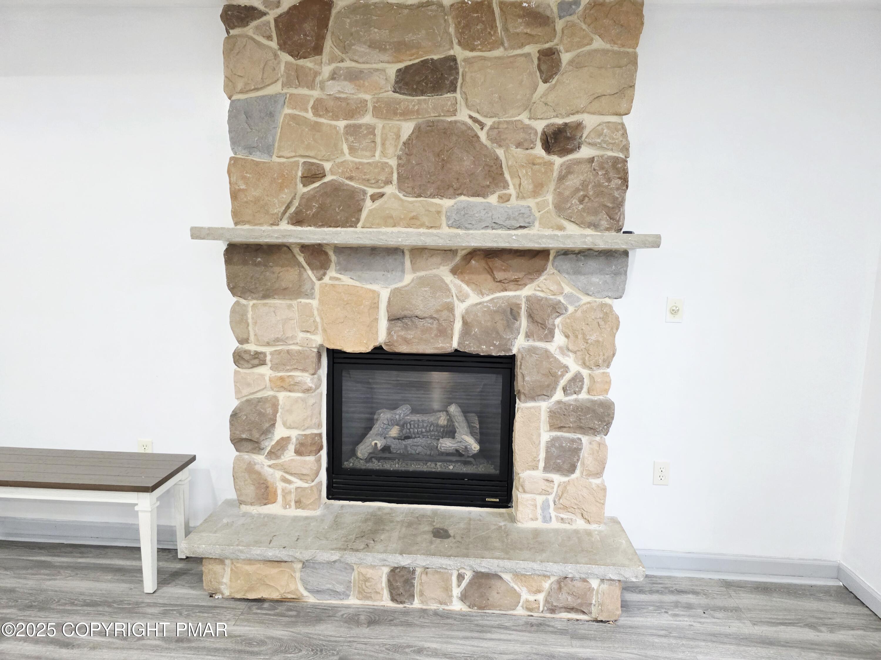 1001 Long Lake Road Tamiment, PA 18371 - Photo 9 of 38 a room with a bench and a potted plant