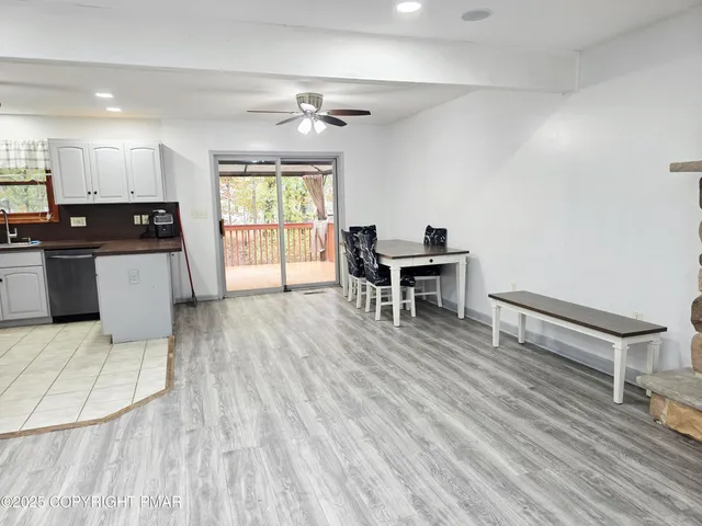 a view of kitchen with furniture and wooden floor