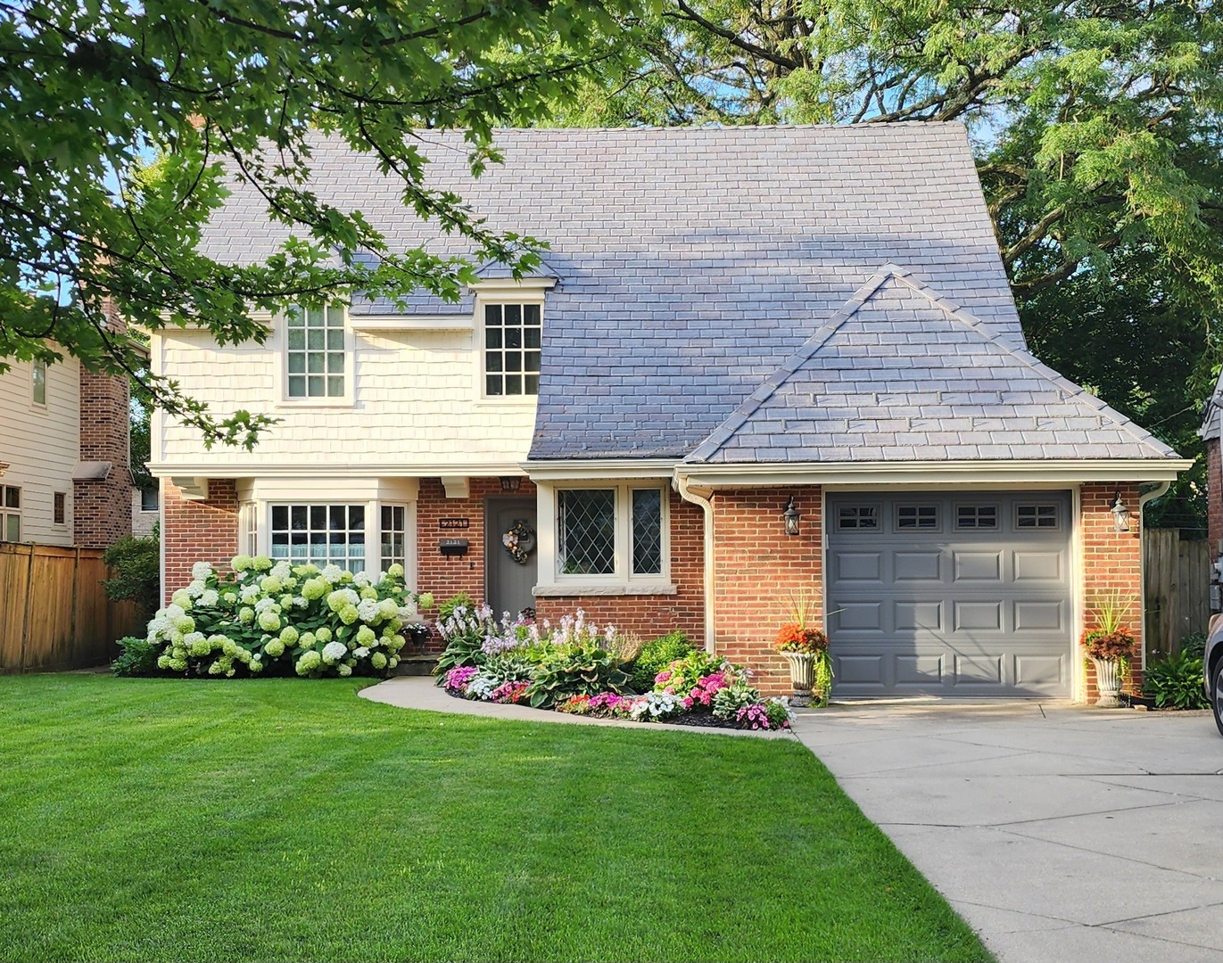 2121 Fir Street Glenview, IL 60025 - Photo 1 of 28 a front view of a house with garden