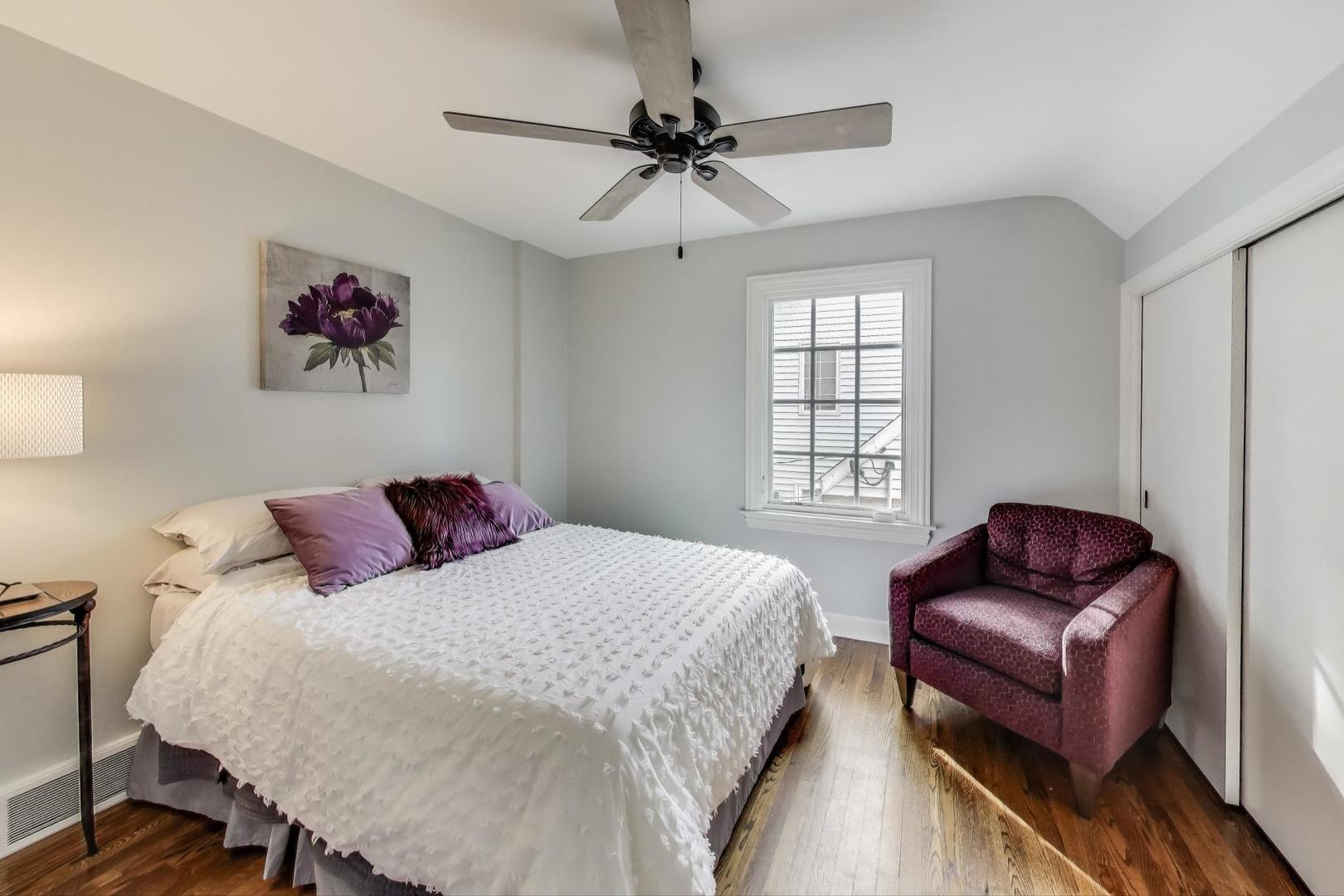 2121 Fir Street Glenview, IL 60025 - Photo 17 of 28 a bedroom with a bed and a couch