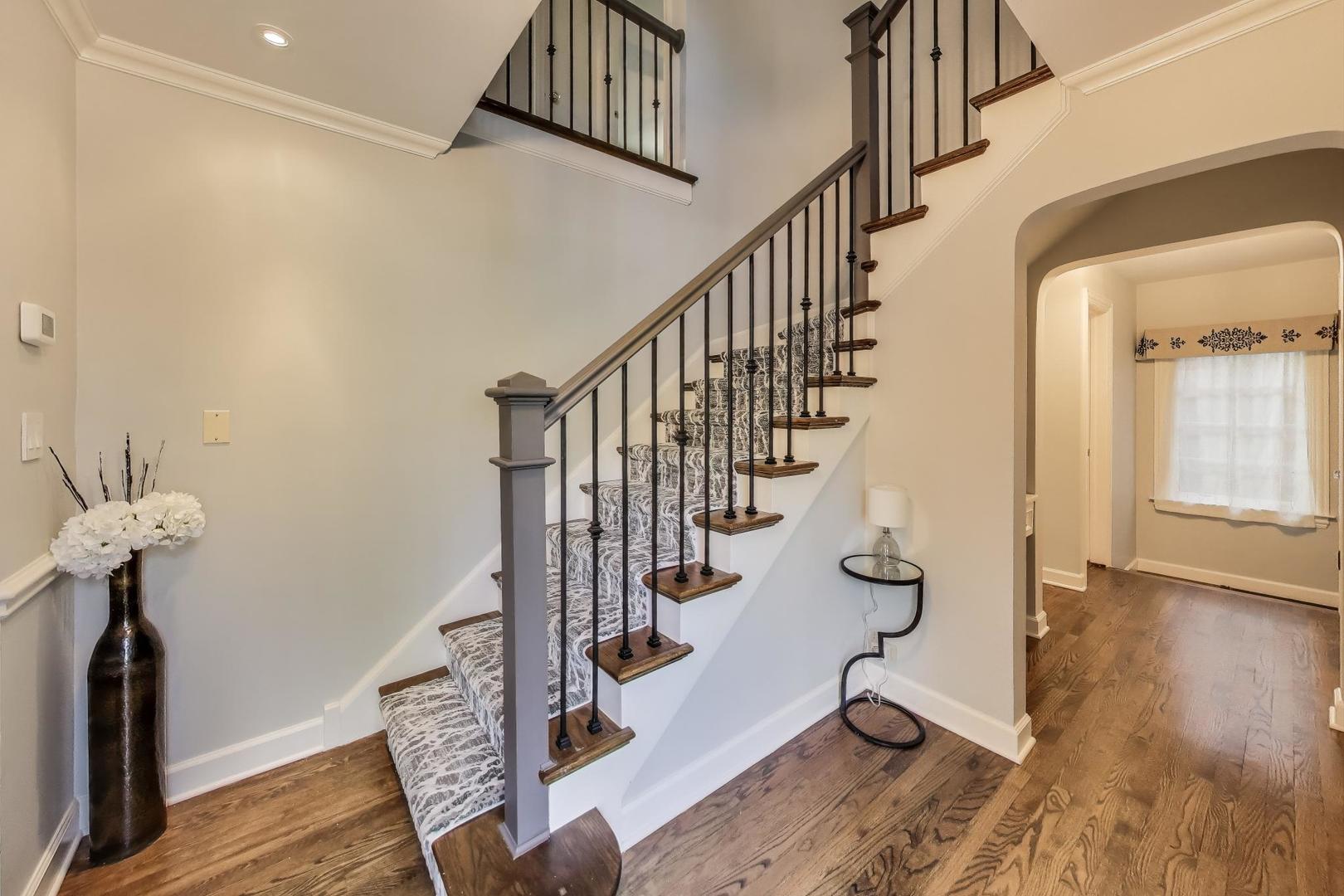 2121 Fir Street Glenview, IL 60025 - Photo 2 of 28 a view of entryway with wooden floor and stairs