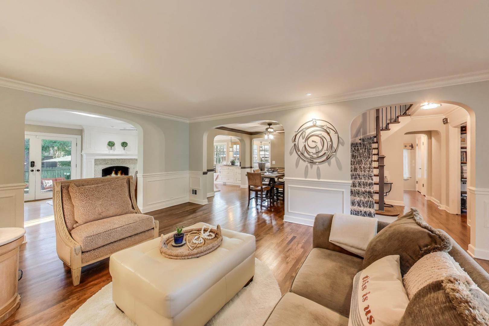 2121 Fir Street Glenview, IL 60025 - Photo 5 of 28 a living room with furniture and a clock