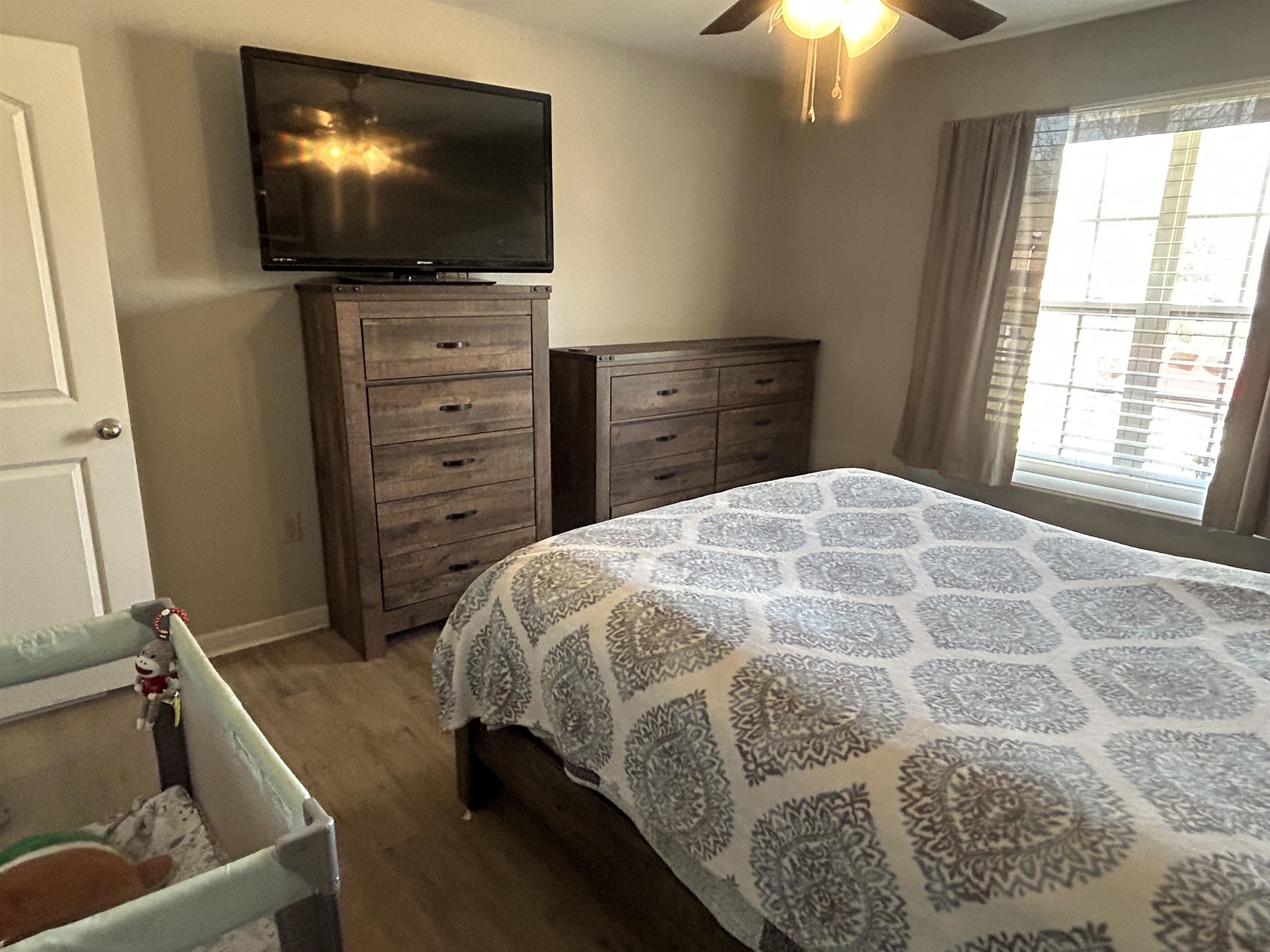 1535 Roane Street Covington, TN 38019 - Photo 11 of 25 Bedroom featuring dark wood-style floors and ceiling fan