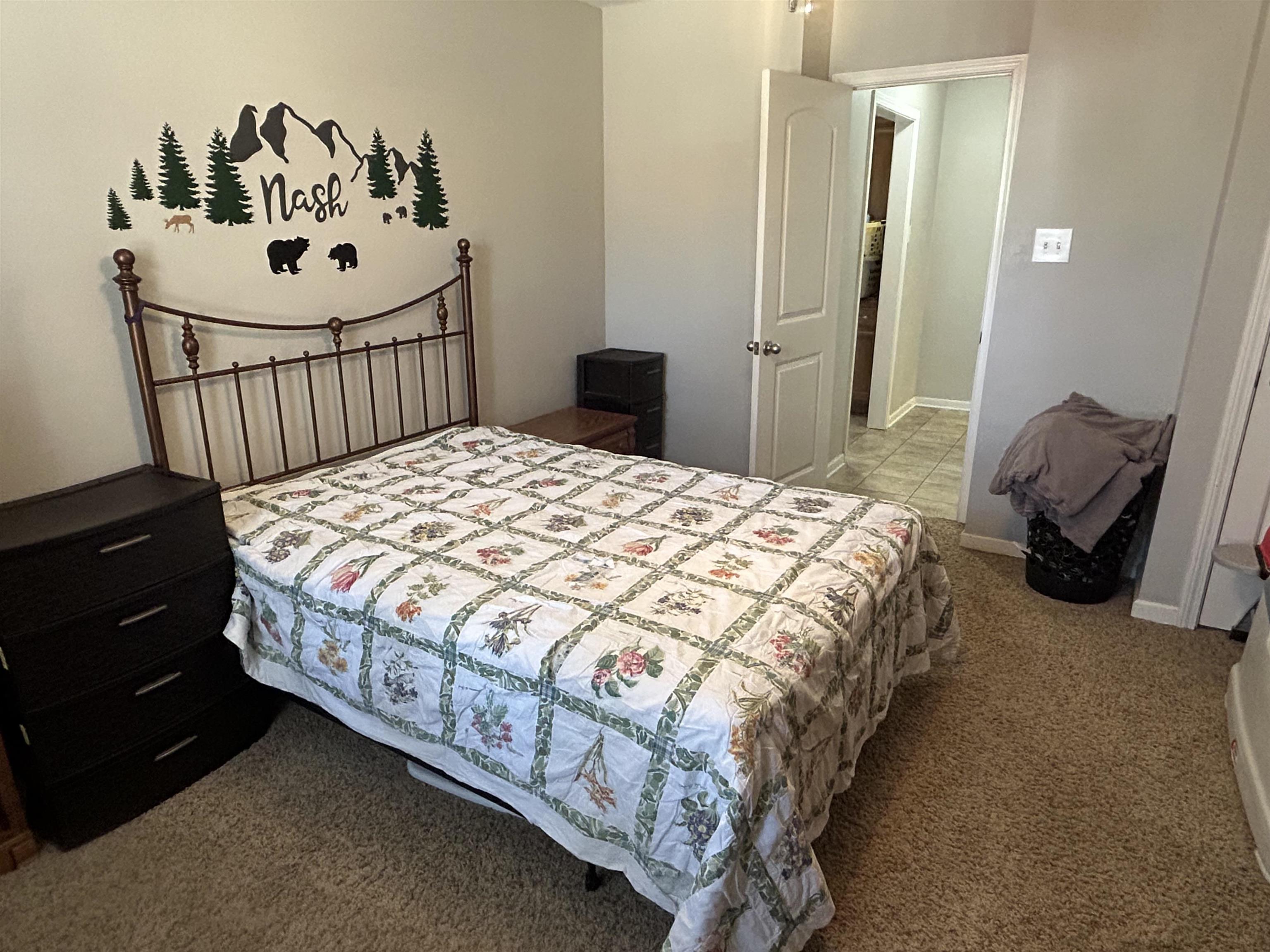 1535 Roane Street Covington, TN 38019 - Photo 14 of 25 Bedroom featuring dark colored carpet and baseboards