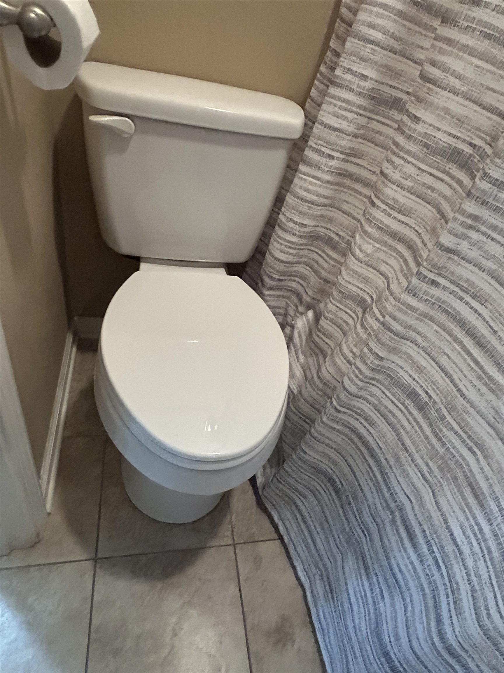 1535 Roane Street Covington, TN 38019 - Photo 16 of 25 Bathroom with toilet and light tile patterned floors