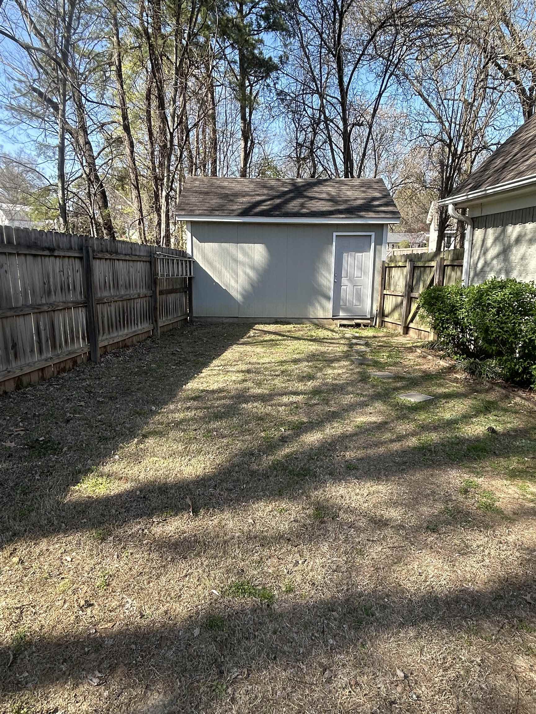 1535 Roane Street Covington, TN 38019 - Photo 22 of 25 Fenced backyard with an outdoor structure
