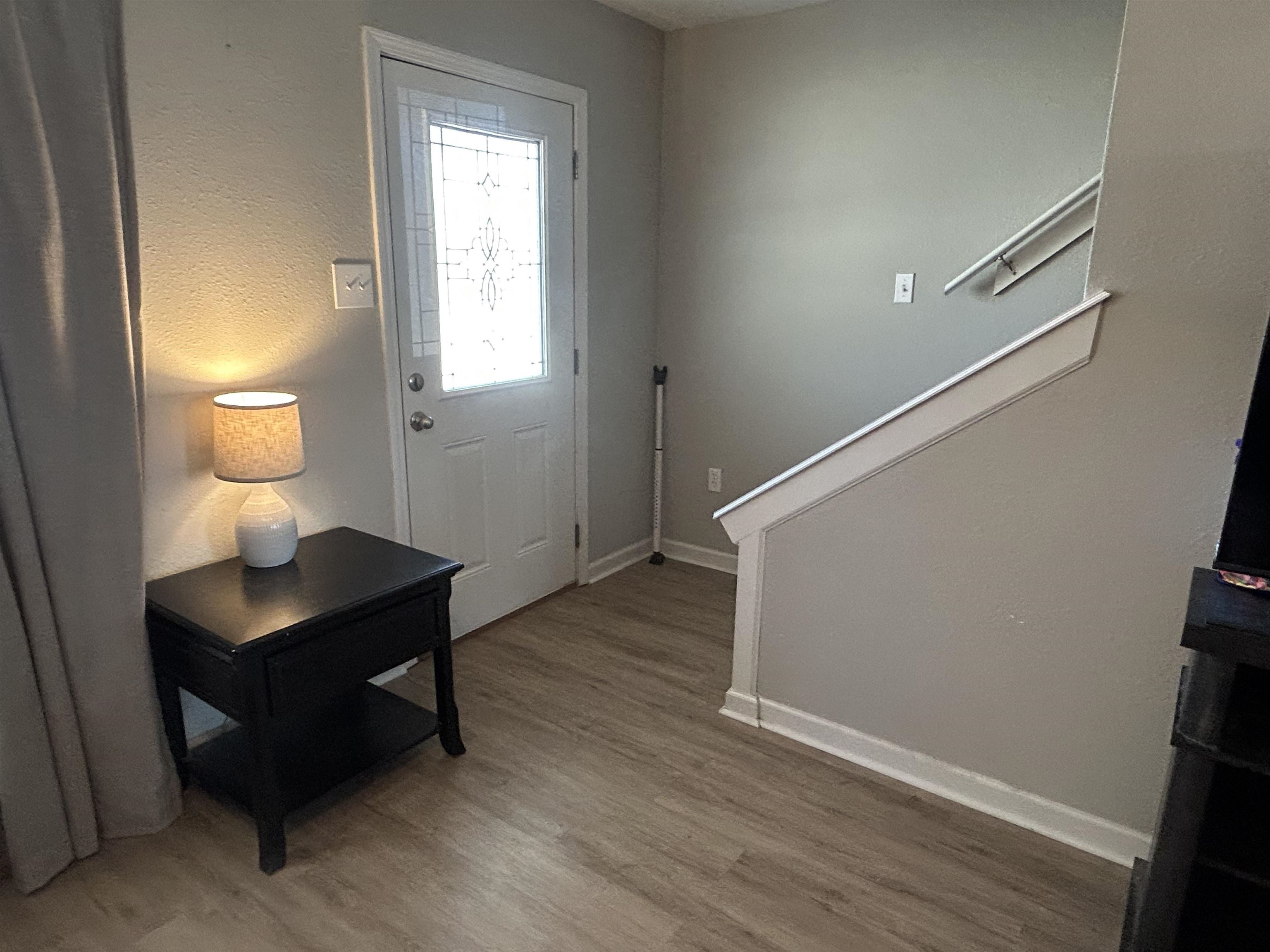 1535 Roane Street Covington, TN 38019 - Photo 9 of 25 Foyer entrance with light wood-type flooring and a textured wall