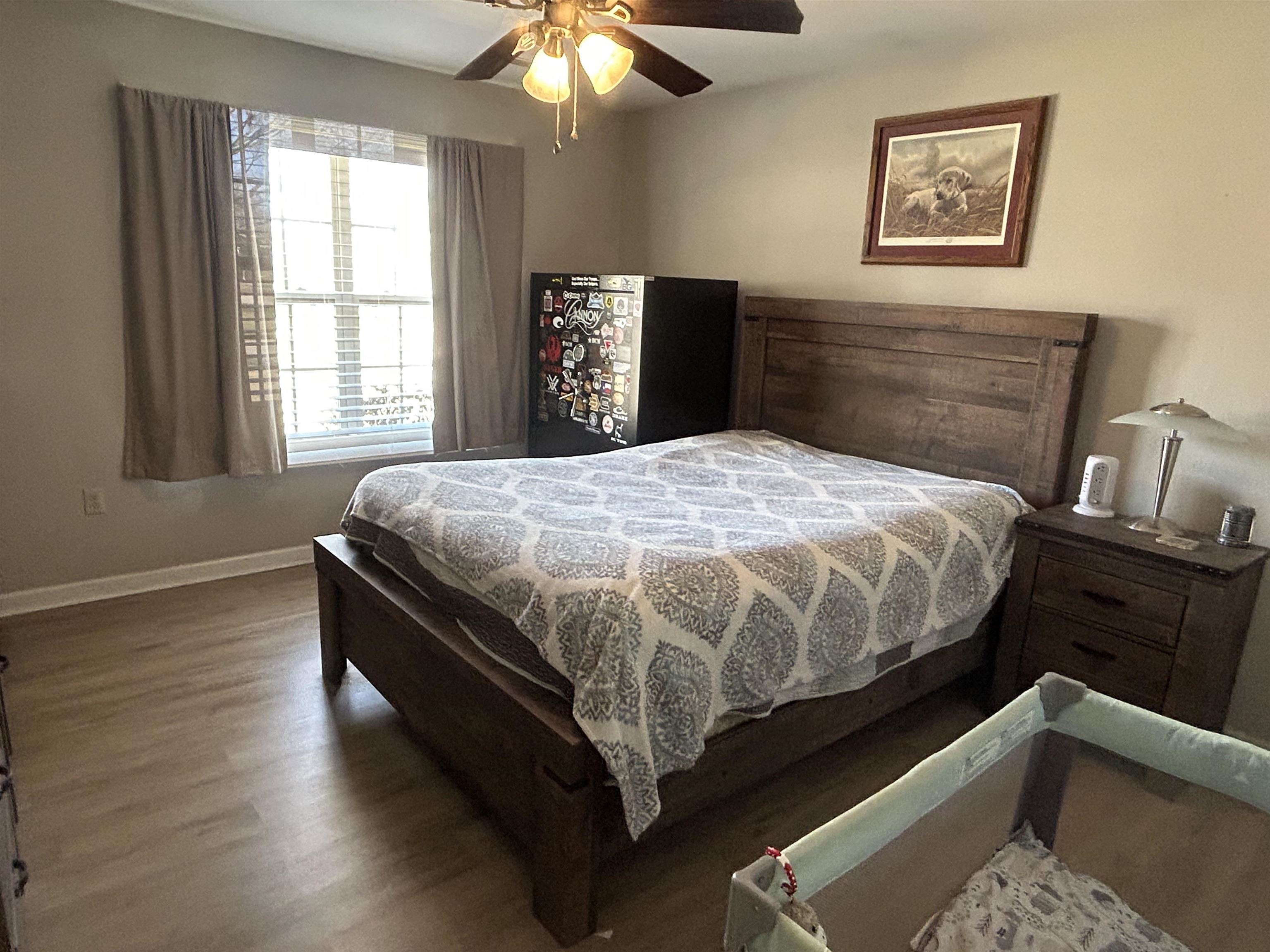 1535 Roane Street Covington, TN 38019 - Photo 10 of 25 Bedroom featuring wood finished floors and ceiling fan