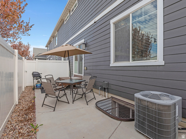 12214 Sunpark Lane Draper, UT 84020 - Photo 20 of 24 Fenced backyard with a patio area, outdoor dining area, and grilling area