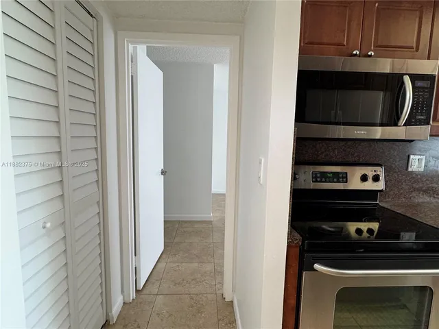 a kitchen with a stove and a microwave
