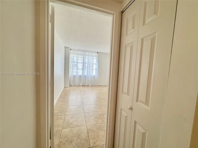 a view of a bathroom with a glass door
