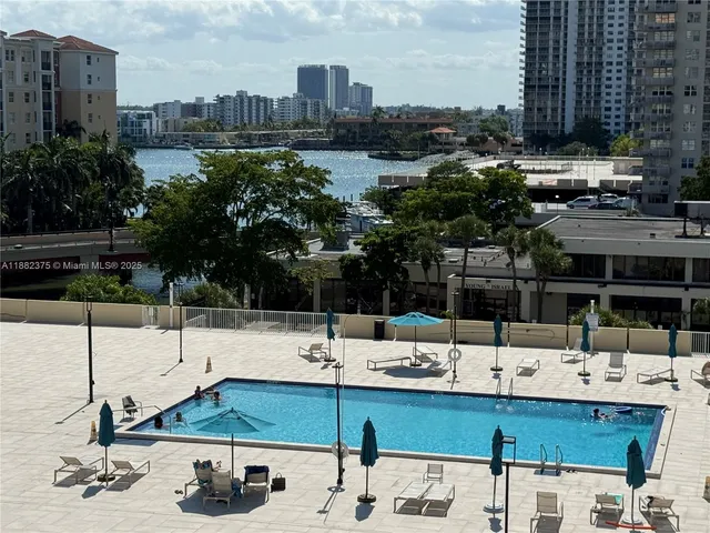 a view of a swimming pool with a patio