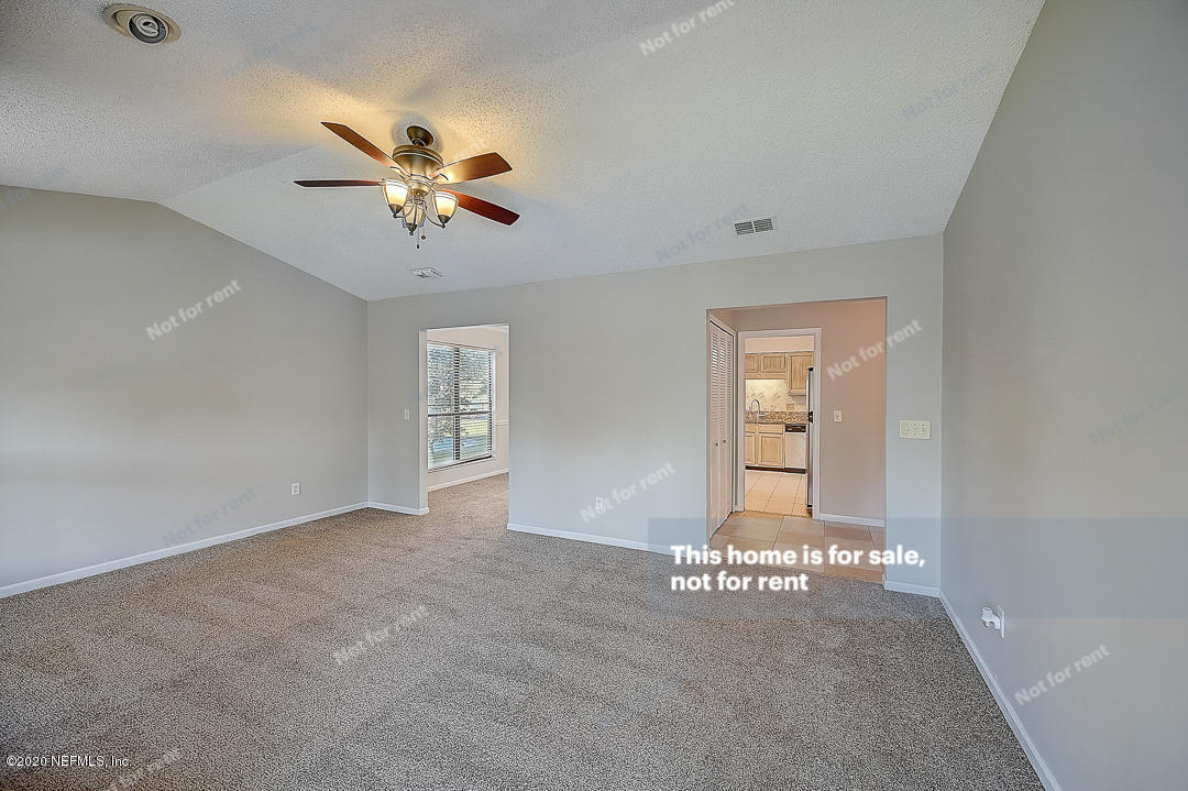 8864 Cherry Hill Drive Jacksonville, FL 32221 - Photo 13 of 17 a view of an empty room with a window