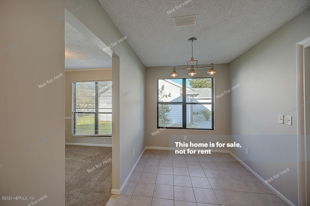 8864 Cherry Hill Drive Jacksonville, FL 32221 - Photo 14 of 17 a view of an empty room with a window