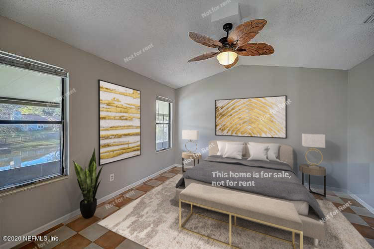 8864 Cherry Hill Drive Jacksonville, FL 32221 - Photo 3 of 17 a living room with furniture and a window
