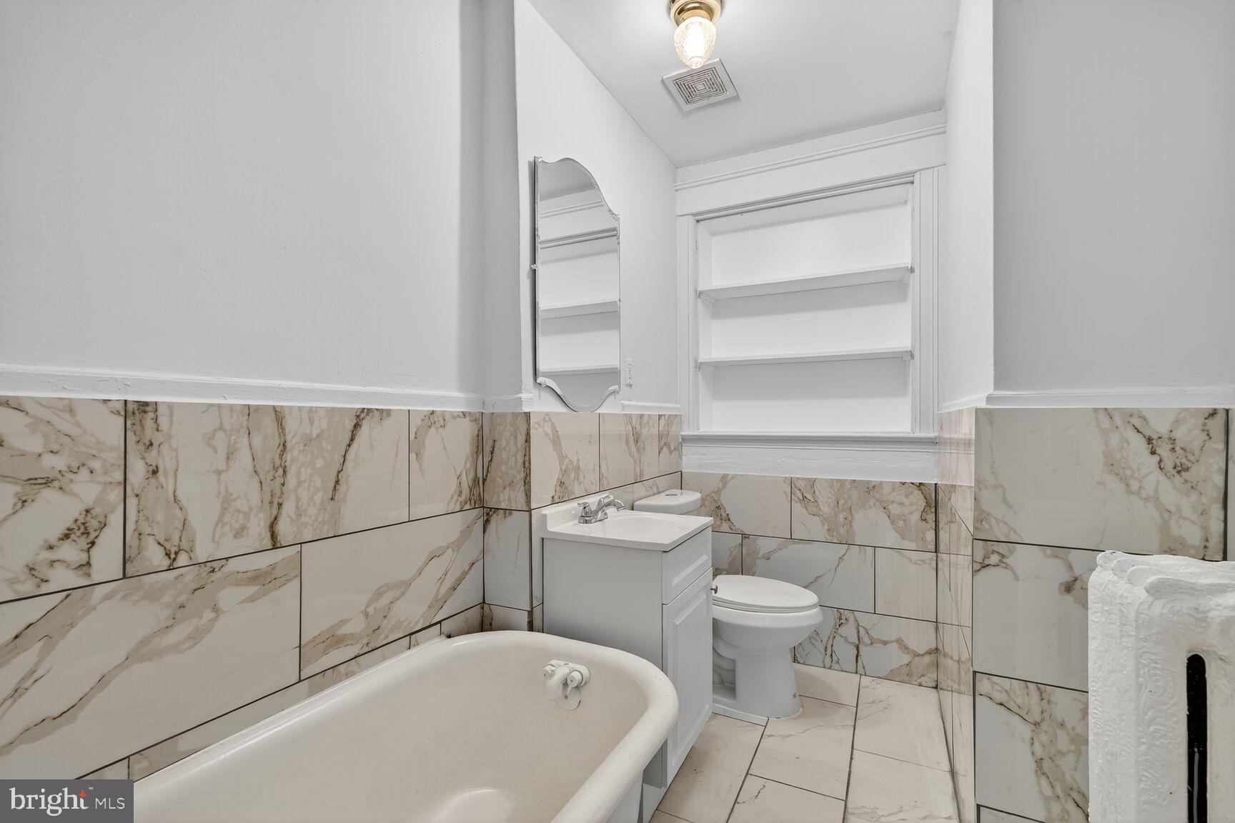 2731 4th Street Northeast Washington, DC 20002 - Photo 17 of 20 a bathroom with a bathtub and toilet