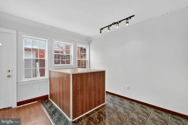 a view of an entryway with wooden floor