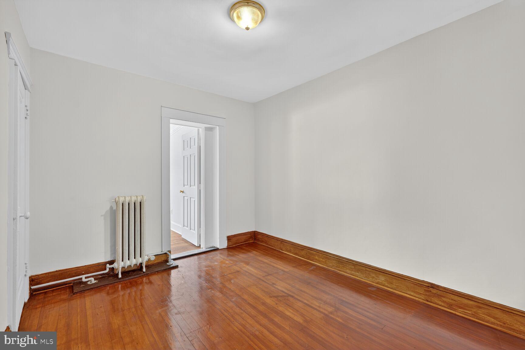 2731 4th Street Northeast Washington, DC 20002 - Photo 10 of 20 an empty room with wooden floor and windows