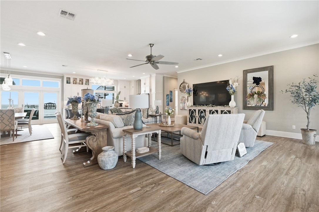 12 Sea Shell Shores Rockport, TX 78382 - Photo 4 of 40 a living room with furniture a flat screen tv and wooden floor