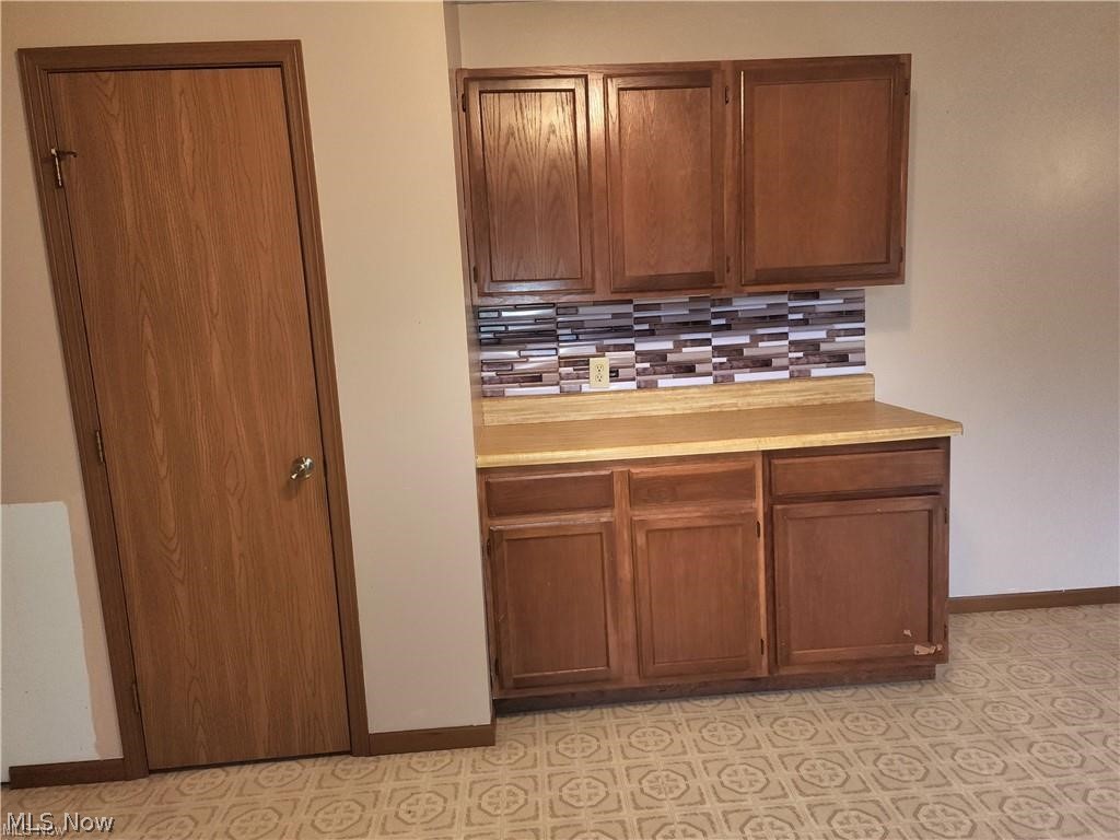 10345 Marne Road Frazeysburg, OH 43822 - Photo 27 of 50 Kitchen with tasteful backsplash and light tile floors