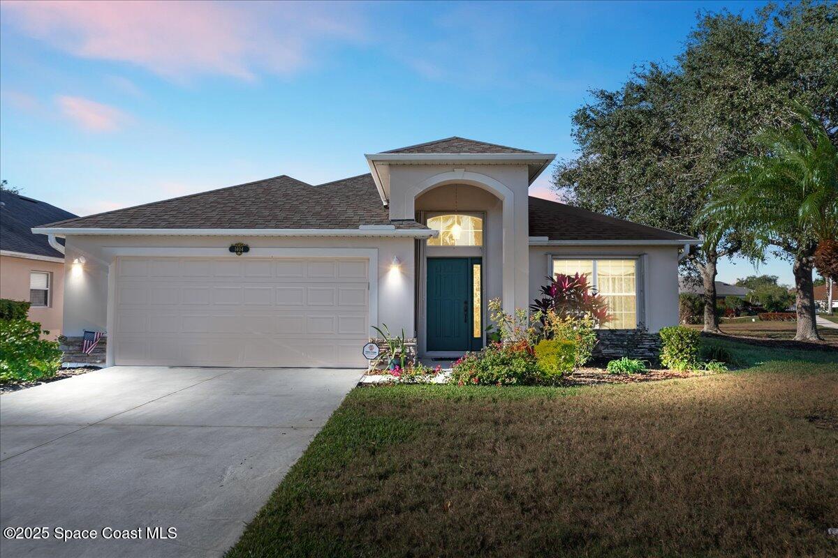 1404 Boca Rio Drive Melbourne, FL 32940 - Photo 1 of 53 a front view of a house with a yard