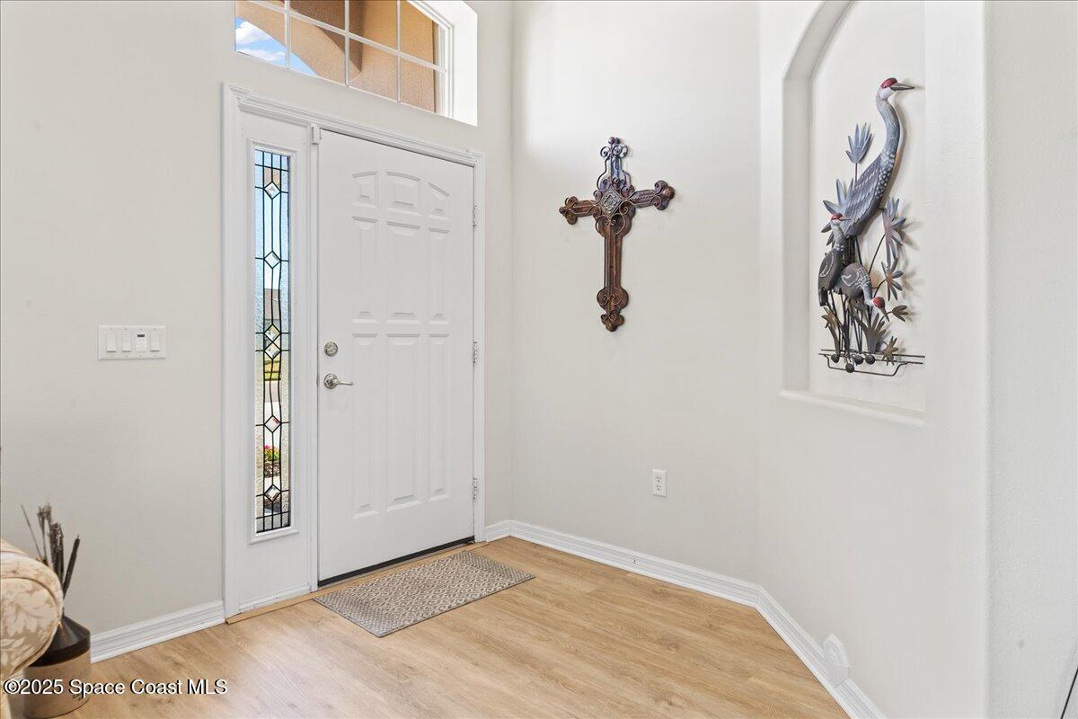 1404 Boca Rio Drive Melbourne, FL 32940 - Photo 12 of 53 a view of a livingroom with a hallway