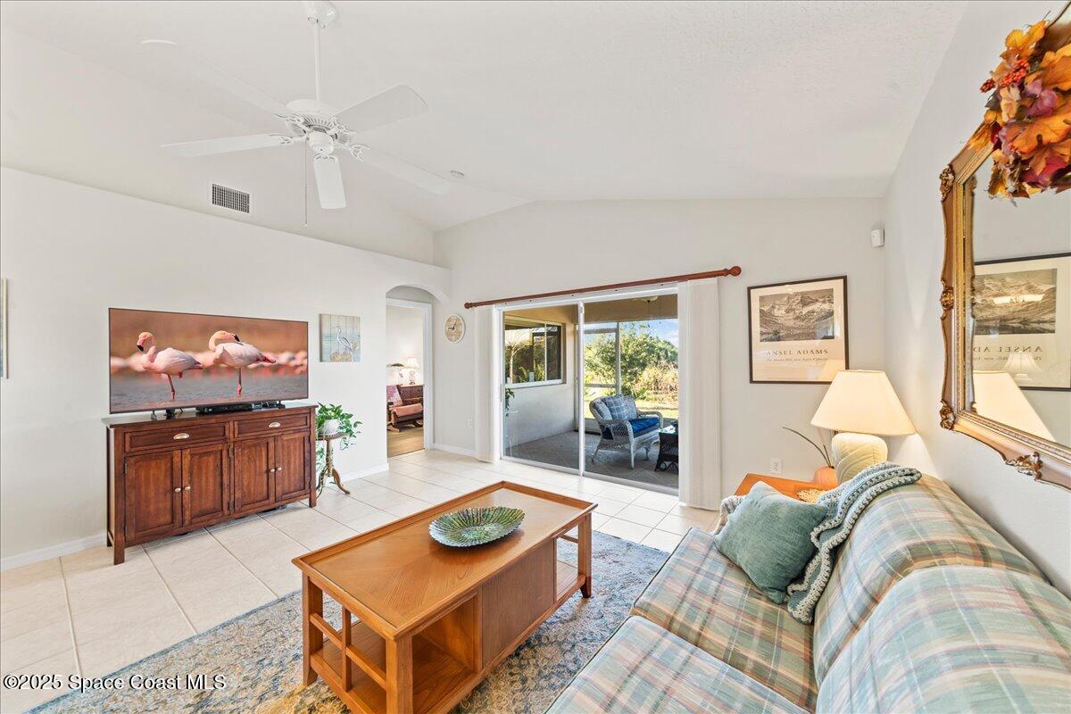 1404 Boca Rio Drive Melbourne, FL 32940 - Photo 21 of 53 a living room with furniture and a flat screen tv