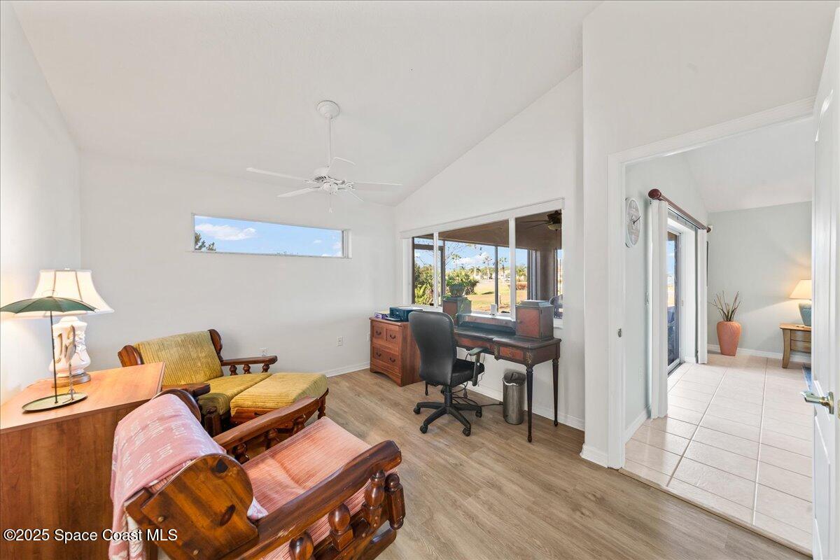 1404 Boca Rio Drive Melbourne, FL 32940 - Photo 24 of 53 a living room with furniture and a wooden floor