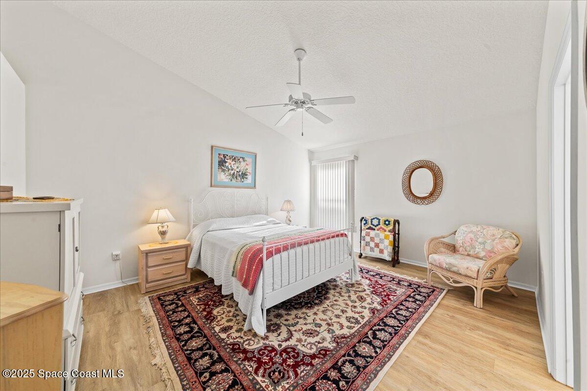 1404 Boca Rio Drive Melbourne, FL 32940 - Photo 25 of 53 a bedroom with a bed and a window