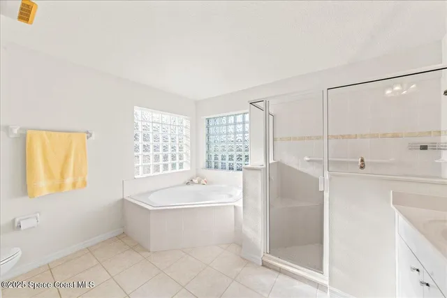 a spacious bathroom with a sink double vanity and a mirror
