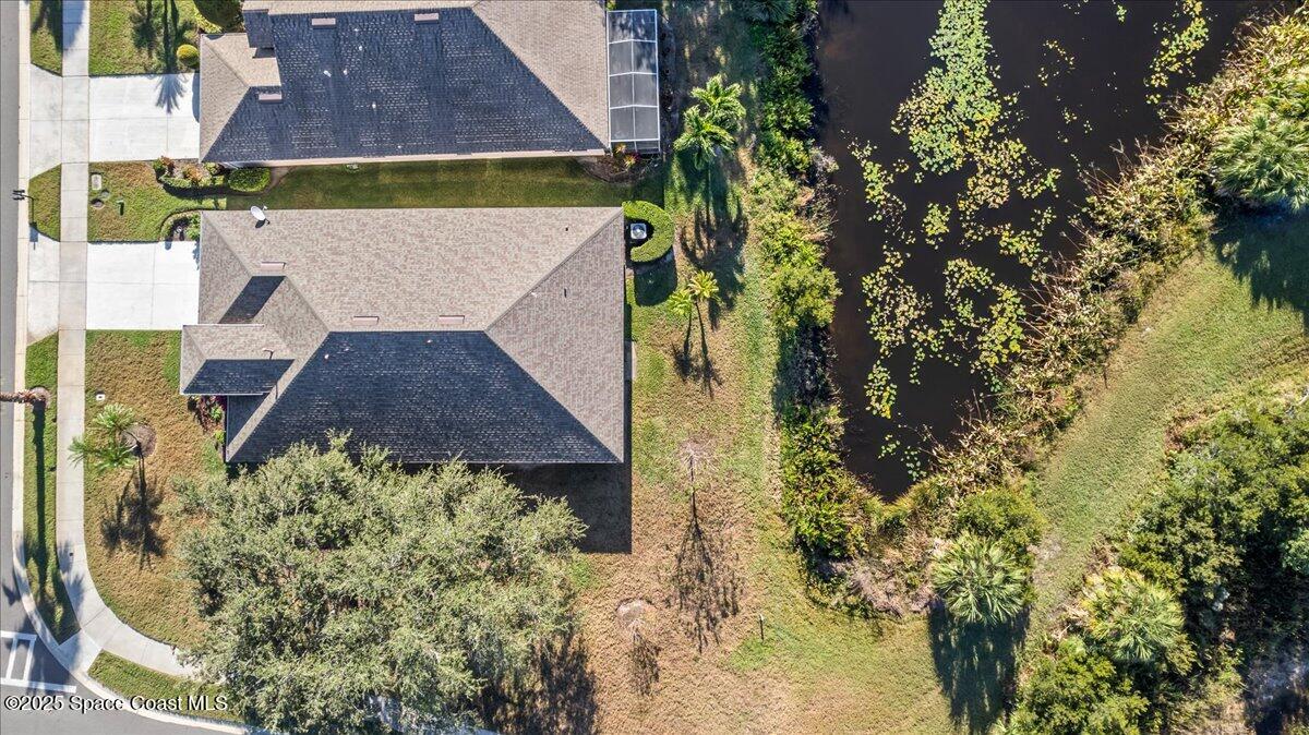 1404 Boca Rio Drive Melbourne, FL 32940 - Photo 43 of 53 an aerial view of a house with a yard