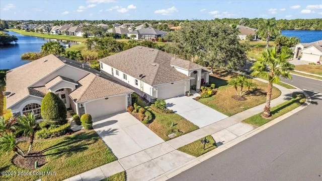 an aerial view of a house with a ocean view