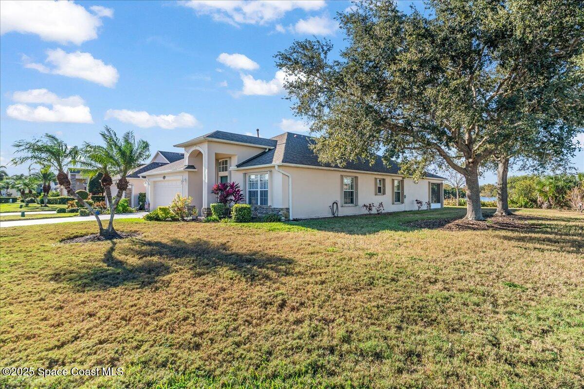 1404 Boca Rio Drive Melbourne, FL 32940 - Photo 7 of 53 a front view of house with yard and trees