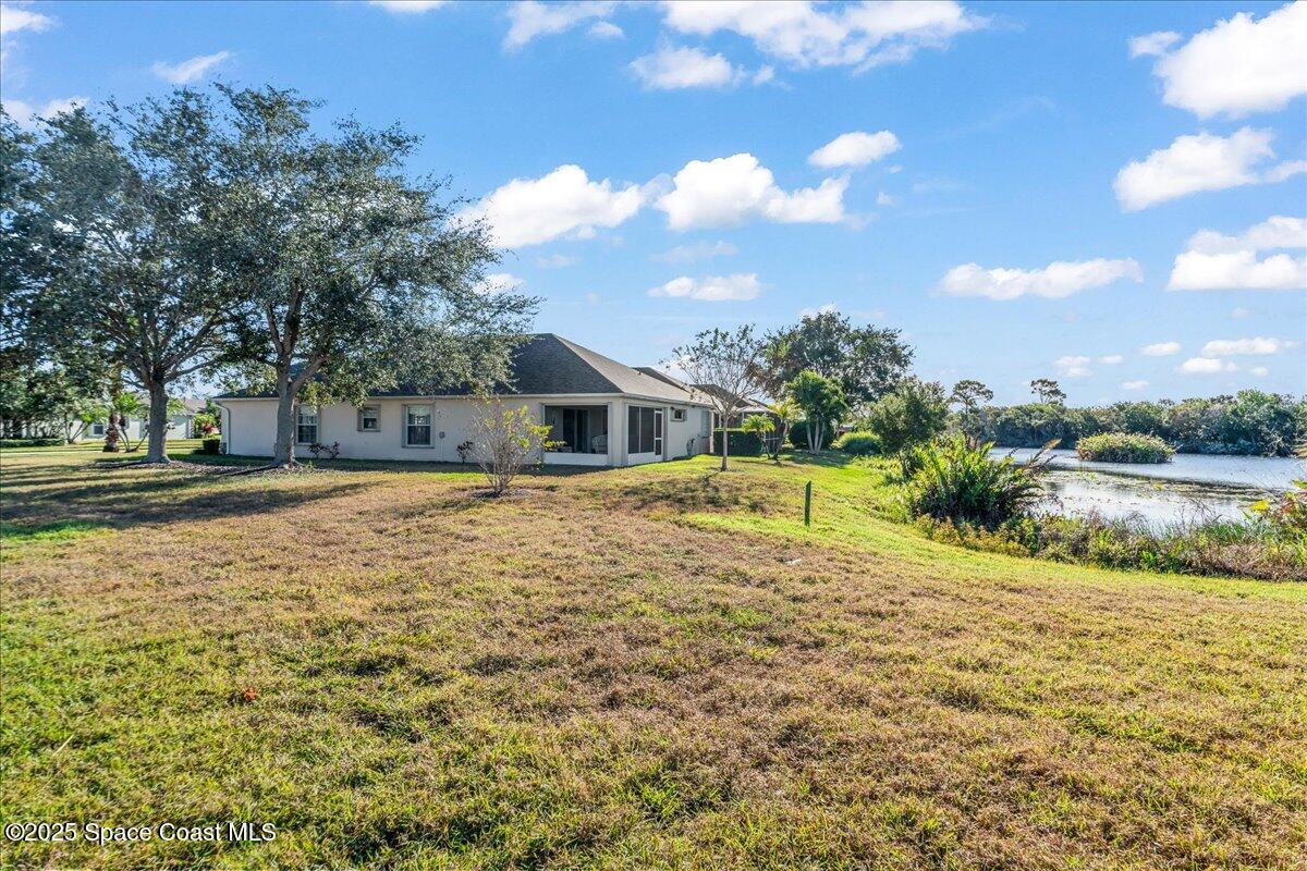 1404 Boca Rio Drive Melbourne, FL 32940 - Photo 8 of 53 a house view with swimming pool in front of it