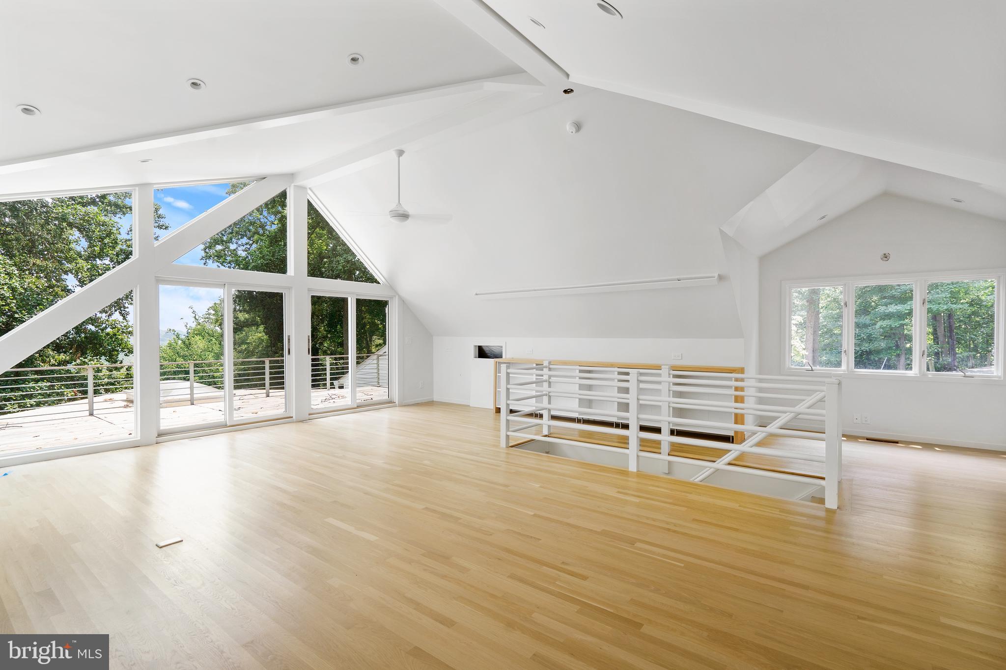 1175 Crest Lane McLean, VA 22101 - Photo 11 of 13 an empty room with wooden floor and windows