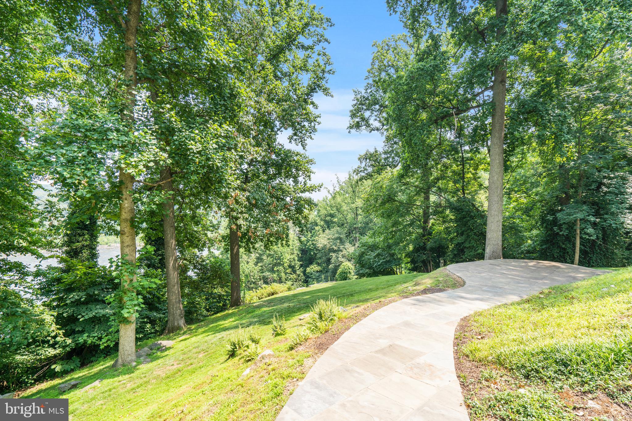 1175 Crest Lane McLean, VA 22101 - Photo 6 of 13 a swimming pool with trees in the background