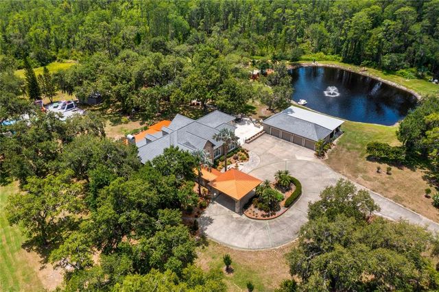 an aerial view of a house with outdoor space