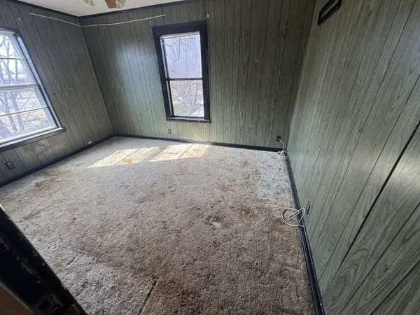 a view of an empty room and window
